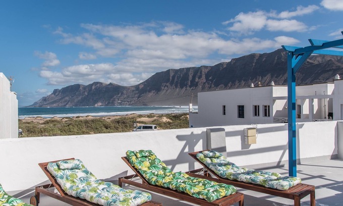 Caleta de Famara Apartment | Beachfront Retreat with Rooftop Terrace & Scenic Views