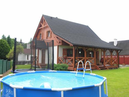 Santoczno House | Experience Santoczno Santohaus: Family-Friendly Retreat