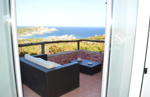 Trinita d'Agultu House | Isola Rossa: Panoramic Beachfront Retreat with Ocean Views