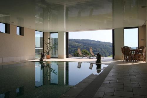 Theux Apartment | Discover Sassor Village: Oceanfront Retreat with Pool Access