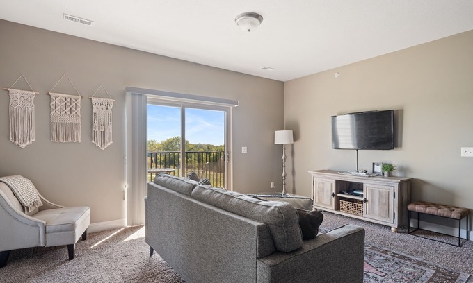 West Des Moines Apartment | Serene Forest Escape with Garage & Family-Friendly Amenities
