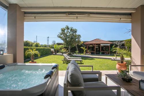 Petaloudes House | Oceanfront Retreat: Sea Breeze & Nature, 4-Star Escape
