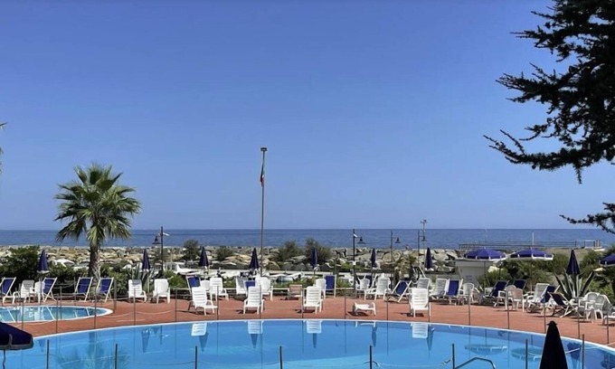 San Lorenzo al Mare Apartment | Scenic Sea View Apartment with Pool and Family-Friendly Amenities