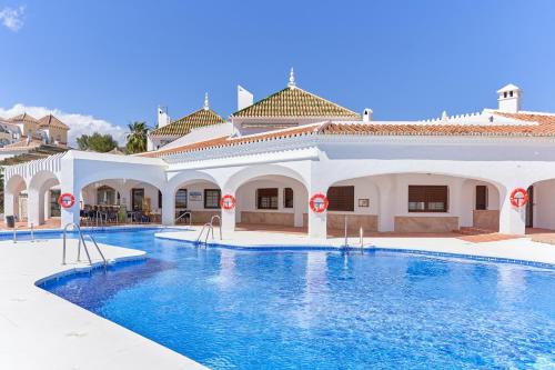 Chimenea Apartment | Sea View Apartment in Nerja with Pool & Family-Friendly Features