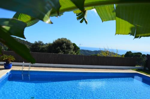 Sant Cebria de Vallalta Villa | Oceanfront Retreat: Pet Friendly with Scenic Pool & Nature
