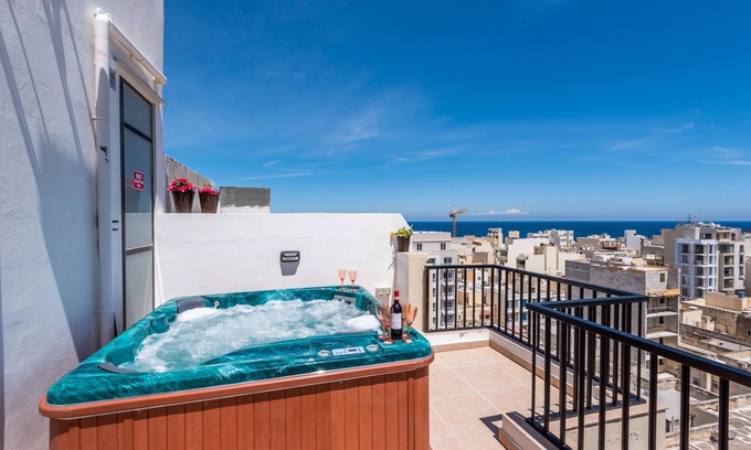 Bugibba Apartment | Stunning Seashells Penthouse with Hot Tub & Ocean View