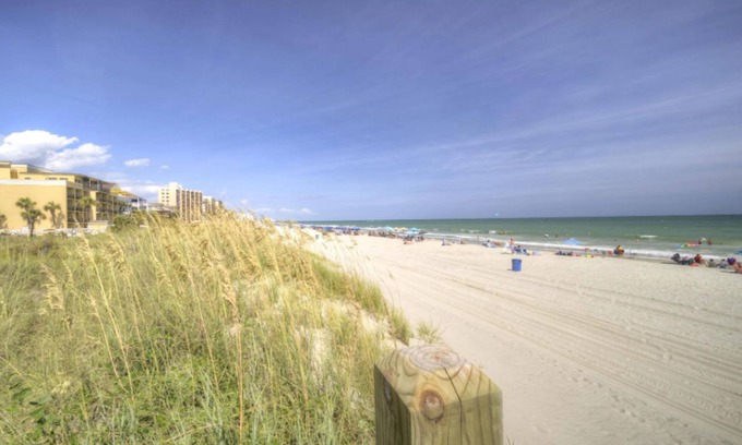 Crescent Beach Condo | Seaside Elegance: Your Coastal Getaway with Pool & Breakfast