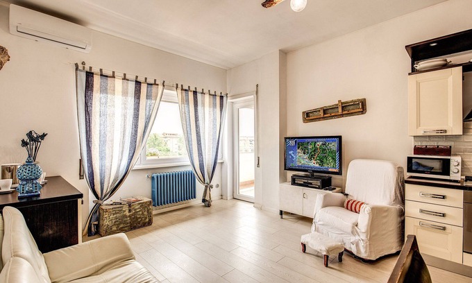 Quartiere XXXIII Lido di Ostia Ponente Apartment | Seaside Rome APT: Oceanfront Getaway with Top Amenities
