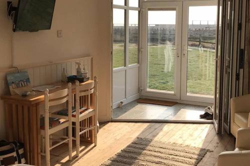 West Bay Apartment | Oceanfront Studio on Coastal Path - Rated 9.2/10 by Guests