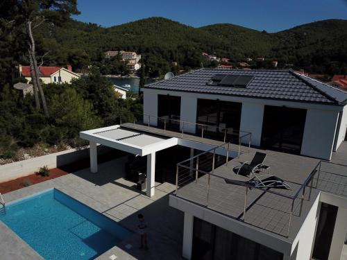 Prizba House | Seaside Villa at Prizba: Oceanfront Bliss with Pool