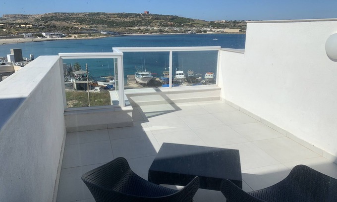 Għadira Apartment | Modern Penthouse with Ocean Views, Steps from the Beach
