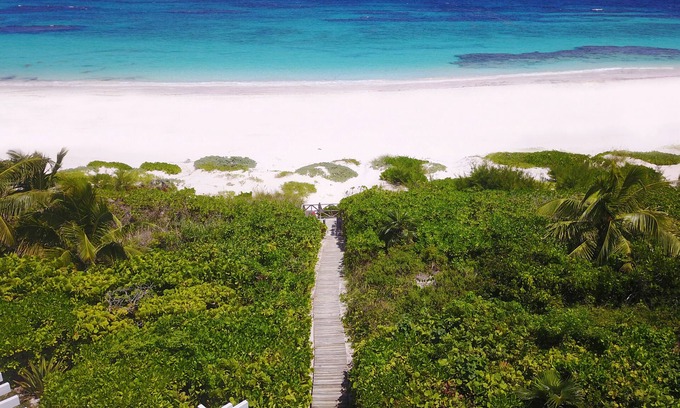 Dunmore Town House | Secluded Beachfront Oasis with Private Access & Ocean Views
