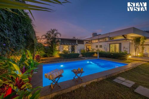 Wadgaon Villa | Serene Garden by VEO - Part of StayVista with Pool and Lawn area