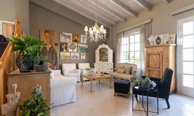 Kalamata House | Oceanfront Oasis: Lush Garden Retreat with Unmatched Views