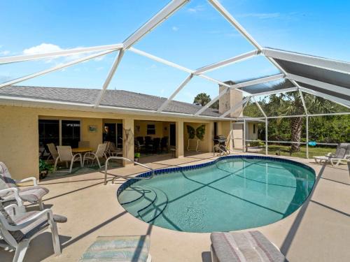 Port Charlotte House | Serene & Spacious Family Haven- Pool Lounges BBQ