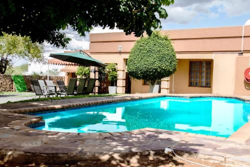 Kgatleng House | Top-Rated Shape Inn Guest House with Pool & Breakfast