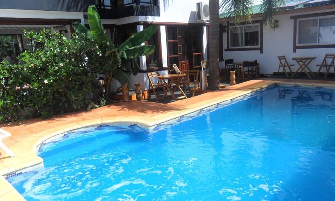 Puerto Iguazu Hotel | Cozy Stay at Si Mi Capitán: Oceanfront Cabañas Awaits!