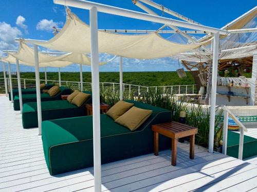 Ek Balam Village Hotel | Discover Siente Tulum: Family-Friendly Oasis with Pool