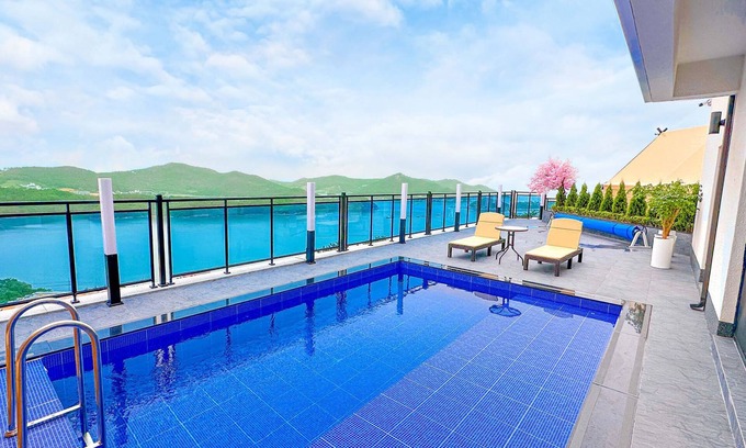 Dolsan-eup Hotel | Relax at Simer Resort: Poolside Retreat for Families