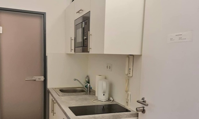 Karlsruhe City Centre House | Contemporary Simplex Apartments am Ludwigsplatz with Kitchen