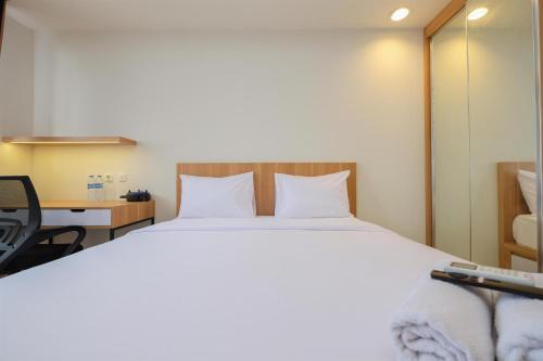 Pondokcina Apartment | Stylish Design Studio Room at Evenciio Margonda Apartment
