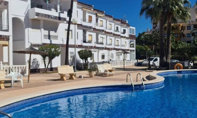 Punta Prima Apartment | Sit back and relax in a stylish space just a few steps from the beach! n