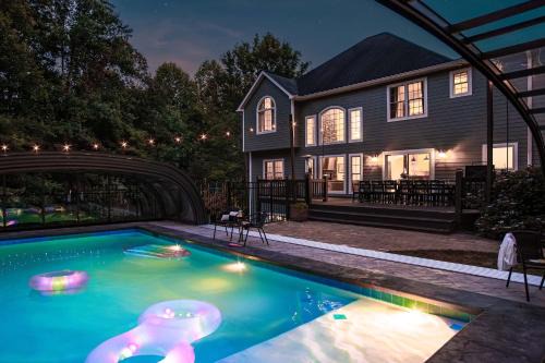 Candler House | Discover the Slide Speakeasy: Movie Room & Hot Tub Retreat