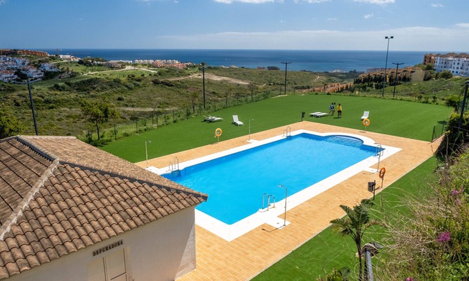 Manilva Apartment | Unwind at Small Oasis: Sea View with Pool & Spa Access