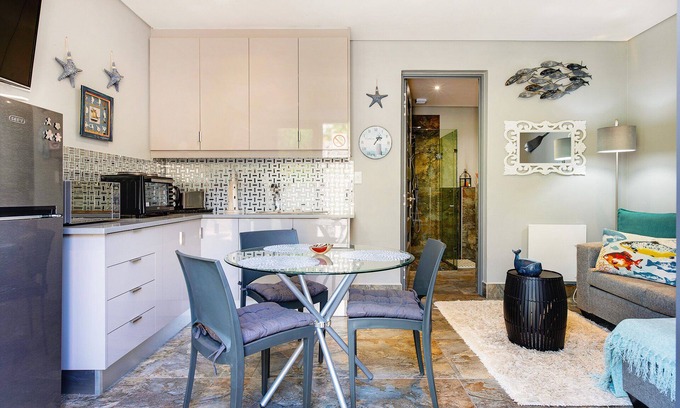 Camps Bay Apartment | Eco-Friendly Retreat with Oceanfront Views and Terrace