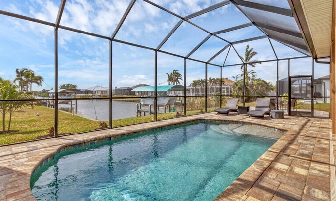 South Gulf Cove House | Discover South Gulf Cove: 3 Bedroom Canal Home with Pool