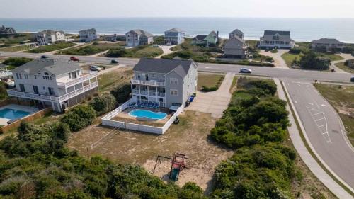 Kitty Hawk House | Discover Southern Paws: Pet-Friendly Retreat with Pool