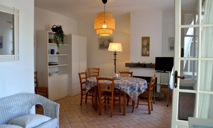 Lido di Capoliveri Apartment | Bright Apartment Steps from the Beach with Spa & Breakfast