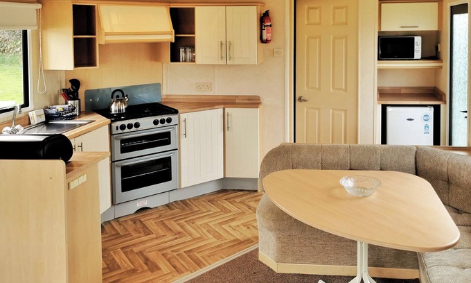 Llanllwchaiarn House | Welcome to Your 12ft-Wide Oceanfront Caravan Retreat
