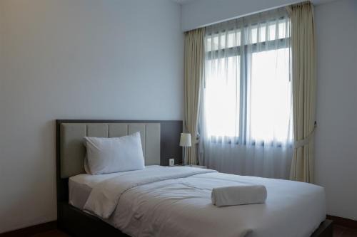 Kebayoran Lama Apartment | Spacious and Modern 3BR Apartment at Simprug Park Residences By Travelio