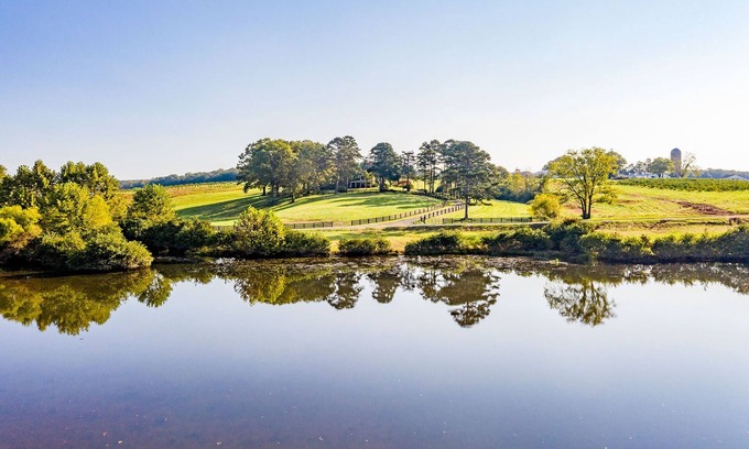 Rustburg House | Idyllic Apple Orchard Stay: Grand Farmhouse & Lake Views
