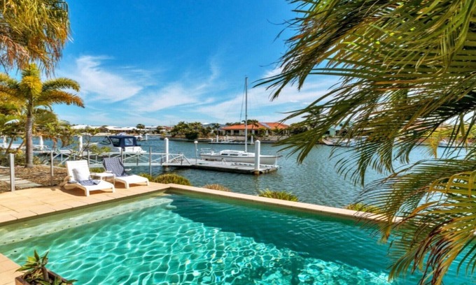 Banksia Beach House | Elegant Canal Home with Private Pool and Pontoon Access