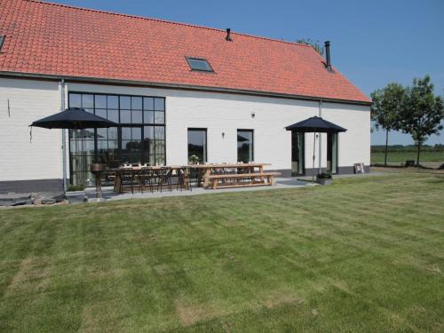 Zuidzande House | Charming Zuidzande Farmhouse with Private Garden & Pool