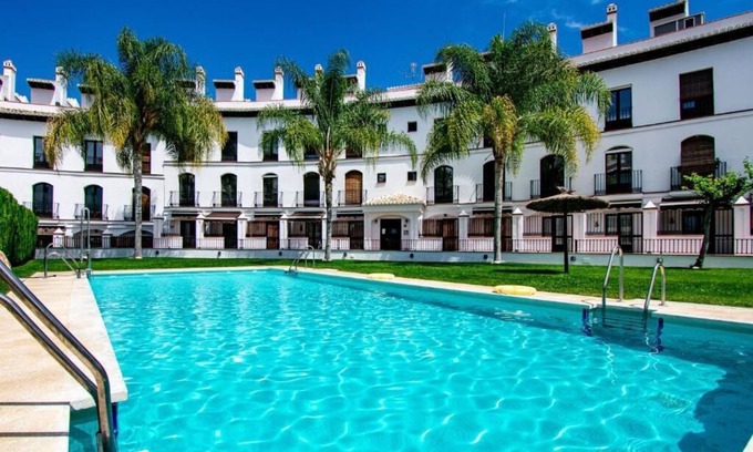 Velez de Benaudalla Apartment | Inviting Duplex with Roof Terrace & Ocean Views