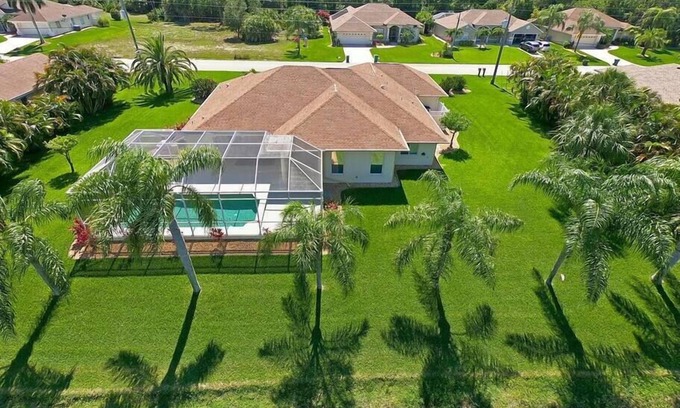 Long Meadow House | Relaxing Pool with Scenic Canal Views and Family-Friendly Amenities