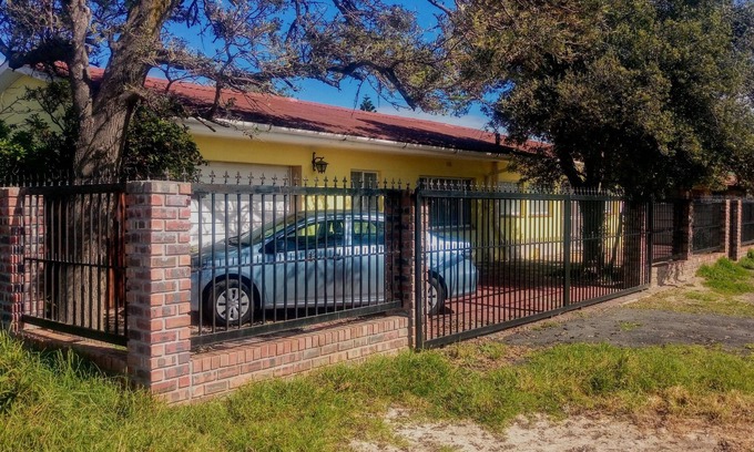 Gordon's Bay Villa | Riverside Villa with Ocean View and Hot Tub Amenities