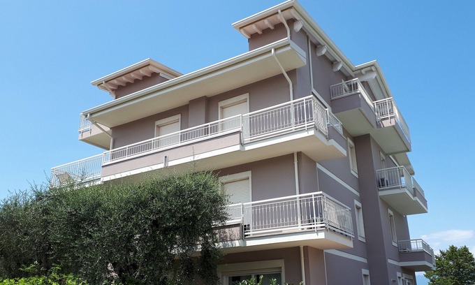 Rivoltella Apartment | Inviting Second Floor Apartment with Lake Views & Amenities