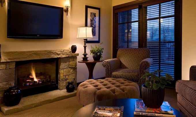 Mountain Village Resort | Inviting Suite with Fireplace, Balcony & Soaking Tub Awaits