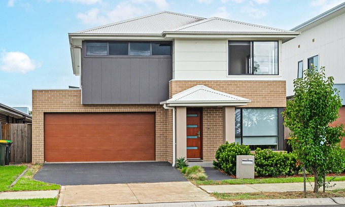 Catherine Field House | Inviting Two-Level 4BR Home in Catherine Field Awaits