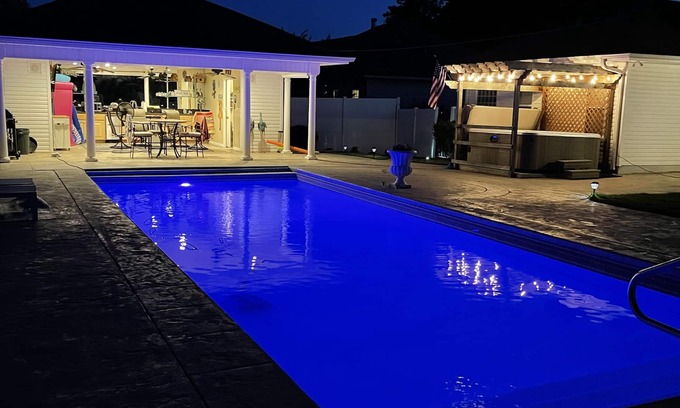 Jones Mills House | Discover a Backyard Oasis with Pool and Ocean Views