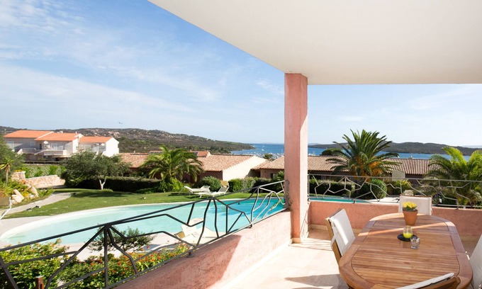 Porto Pozzo Apartment | Seaview Apartment N° 18: Pet-Friendly Oasis with Pool