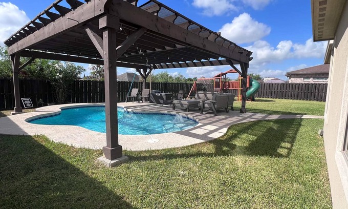 Brownsville House | Elegant Retreat with Pool, Modern Kitchen & Inviting Patio