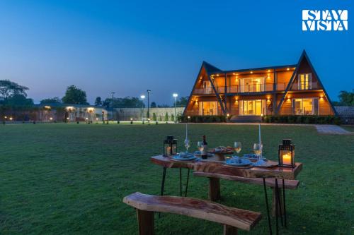 Taoru Villa | StayVista at Aarna Estate with library, lawn