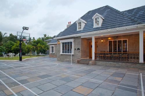 Kozhikode Villa | Unforgettable StayVista at The Stone Villa with Court & Pool