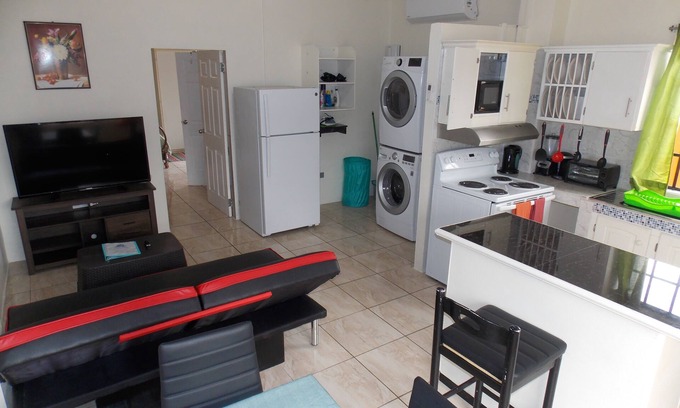 Trincity Apartment | Prime Stewart Hotel Apt in Trincity - Top Amenities Await