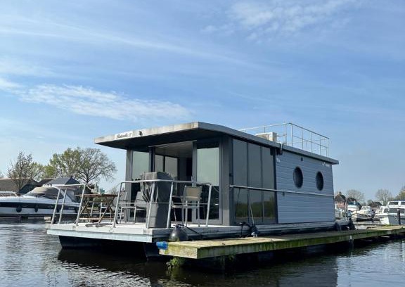 Belt-Schutsloot Boat Rental | Experience a Unique Houseboat Stay in Prime Location!